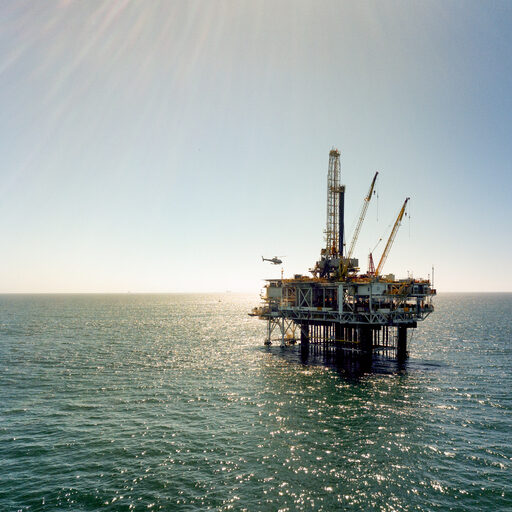 Offshore drilling rig fracking operation near the coast or Southern California near Huntington Beach